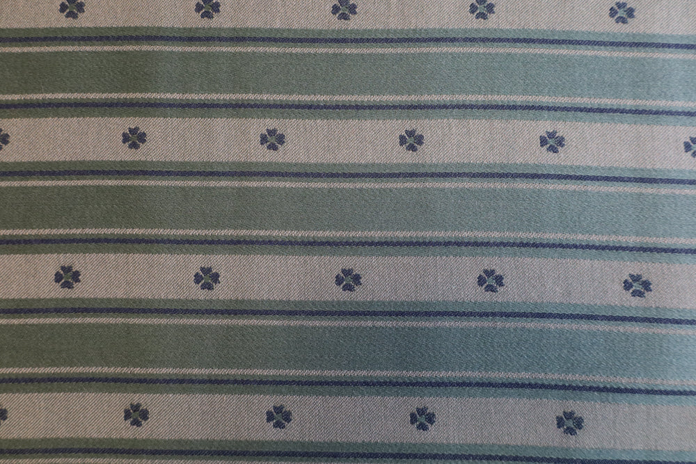 Tosidig grønn / mørk grønn med liten blomst og striper