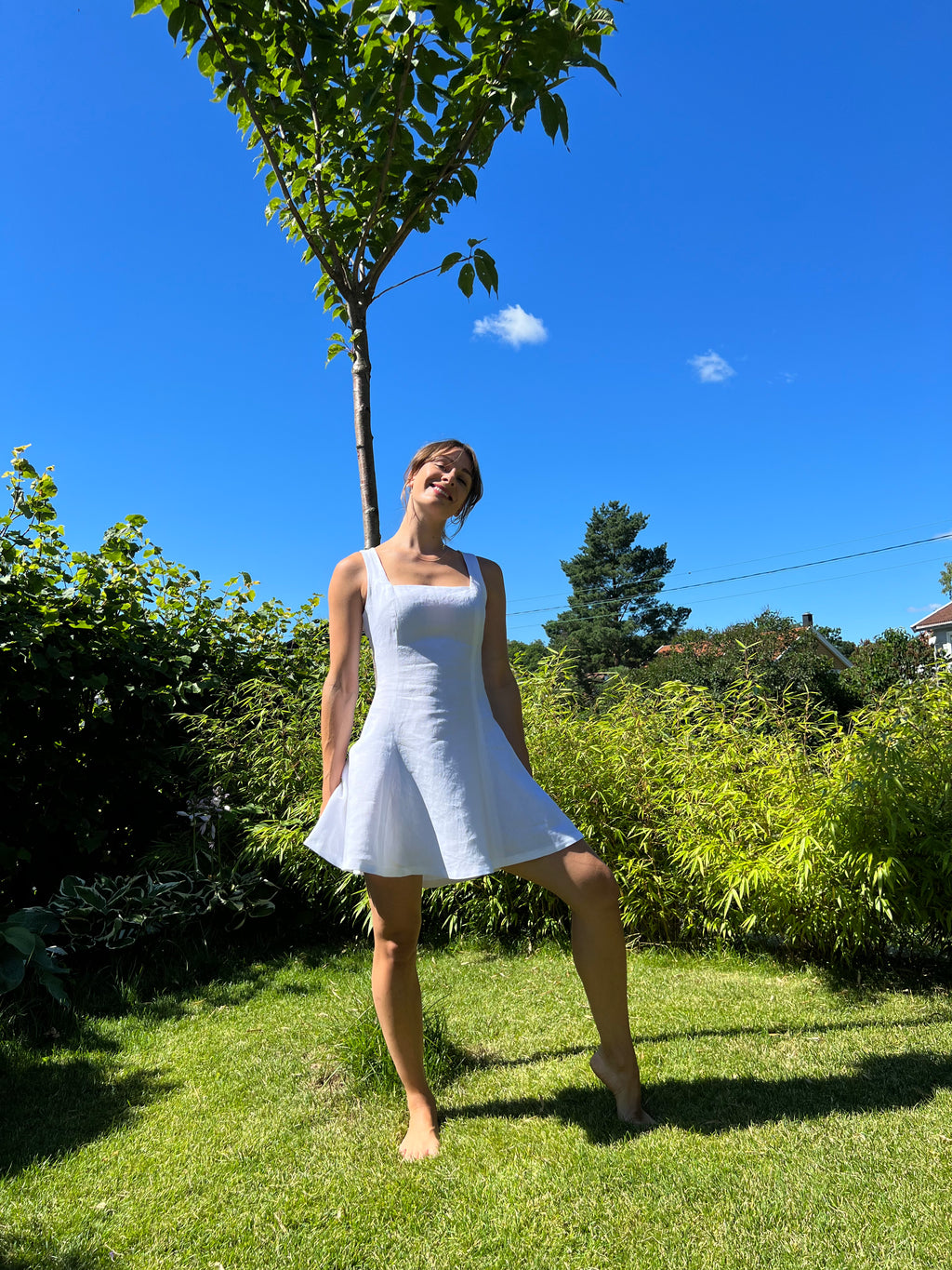 Dressing uten ermer med firkantet utringning